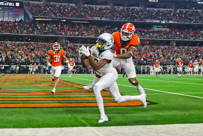 Dec 4, 2021; Arlington, TX, USA; Baylor Bears wide receiver Tyquan Thornton (9) catches a touchdown pass past Oklahoma State Cowboys cornerback Christian Holmes (0) during the first half of the Big 12 Conference championship game at AT&T Stadium. Mandatory Credit: Kevin Jairaj-USA TODAY Sports